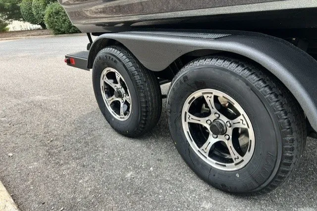 Slide: The Image of Trailer wheels of a 2027 Nitro ZV20 Pro on a paved road. - 11