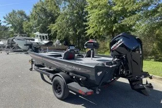 Slide: The Image of 2027 Ranger RT178 boat with Mercury engine on trailer, parked outdoors. - 8