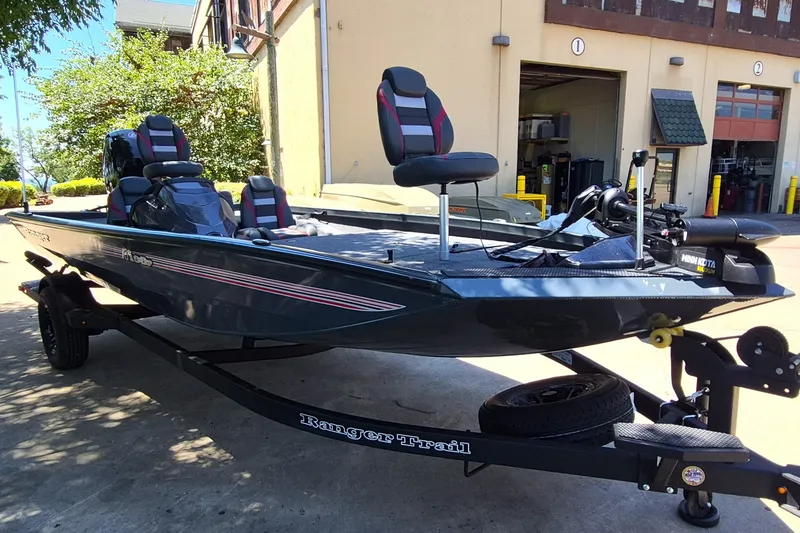 Slide: The Image of 2027 Ranger RT198P fishing boat on trailer outside a building. - 3
