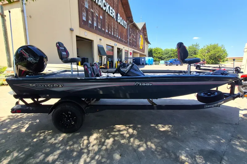 Slide: The Image of 2027 Ranger RT198P boat parked outside Tracker Boats store. - 4