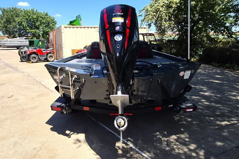 Slide: The Image of 2027 Ranger RT198P boat with powerful outboard motor, parked outdoors. - 6