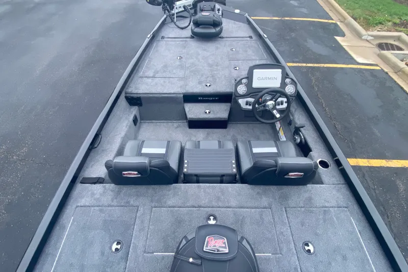Slide: The Image of 2027 Ranger RT188P boat interior with Garmin system, gray carpet, and dual seating. - 7