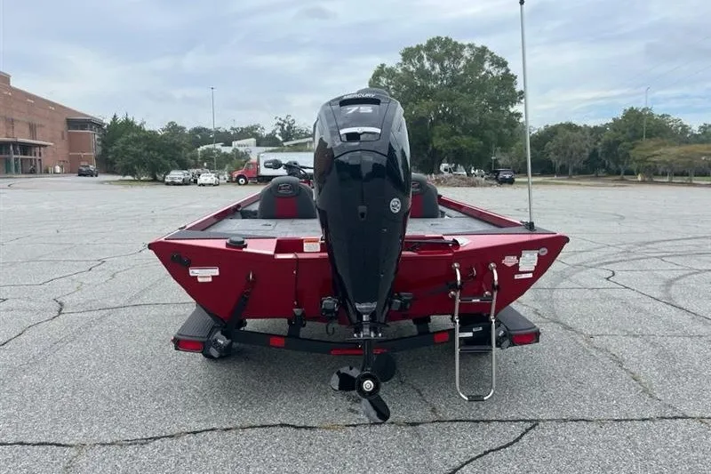 Slide: The Image of Red 2027 Ranger RT178 boat with outboard motor in a parking lot. - 7