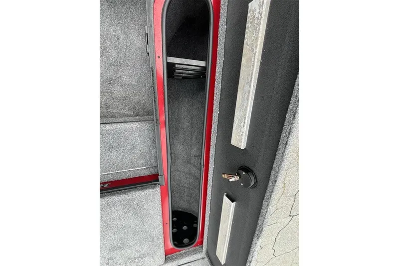 Slide: The Image of Interior storage compartment of 2027 Ranger RT178 boat, featuring a sleek design and secure lock. - 15