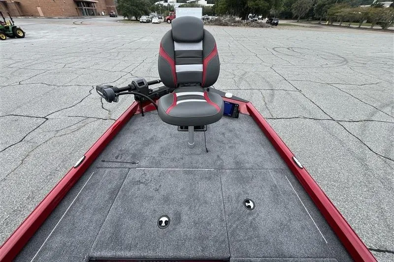 Slide: The Image of 2027 Ranger RT178 boat interior with gray and red seating on a textured deck. - 14