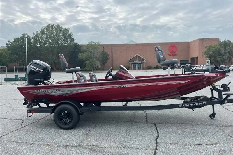 Slide: The Image of 2027 Ranger RT178 boat on trailer, parked in lot near a Target store. - 1