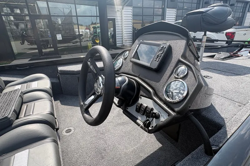 Slide: The Image of Cockpit of 2027 Ranger RT178 boat with steering wheel and navigation system. - 6