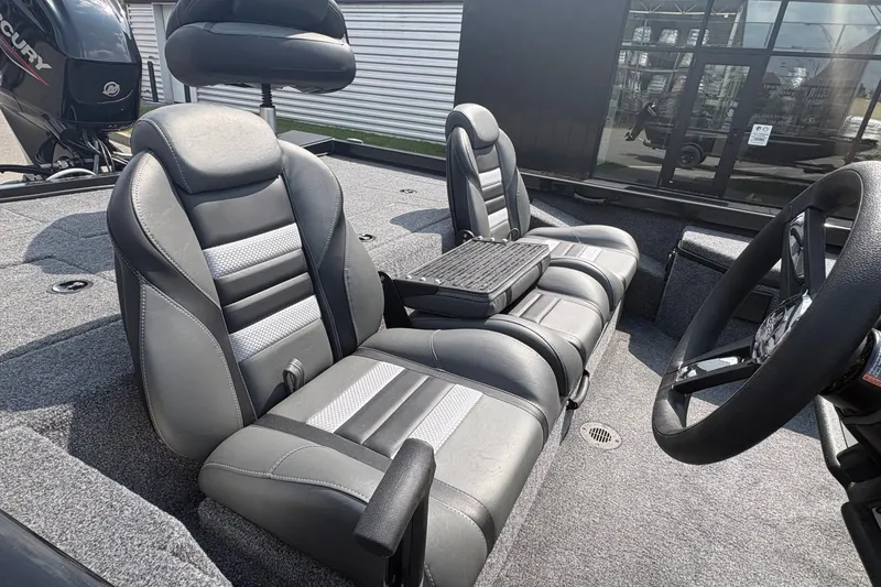 Slide: The Image of 2027 Ranger RT178 boat interior with gray leather seats and steering wheel. - 5