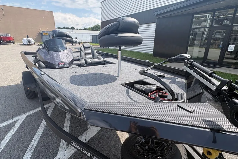 Slide: The Image of 2027 Ranger RT178 boat with sleek design, parked outdoors near a building. - 4