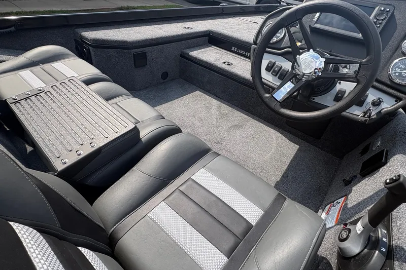 Slide: The Image of Interior of 2027 Ranger RT178 boat with sleek seating and modern steering console. - 8