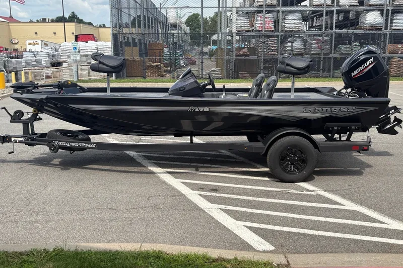 Slide: The Image of 2027 Ranger RT178 boat on trailer, parked in lot, featuring Mercury engine. - 2