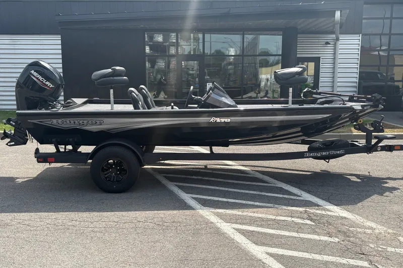 The Image of 2027 Ranger RT178 fishing boat on trailer, parked outdoors. - 0