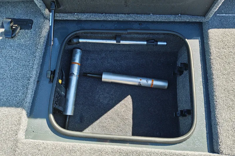 Slide: The Image of Storage compartment of 2027 Ranger RT198P boat with hydraulic components. - 30