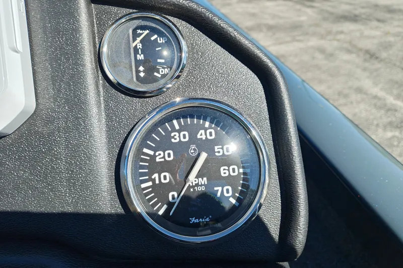 Slide: The Image of Close-up of 2027 Ranger RT198P boat dashboard with RPM and trim gauges. - 17