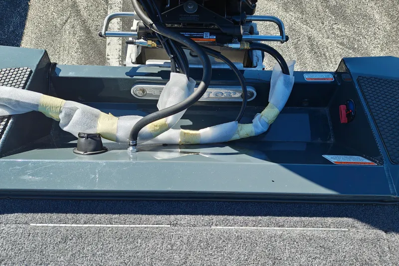 Slide: The Image of 2027 Ranger RT198P boat engine compartment with wrapped cables and textured flooring. - 45