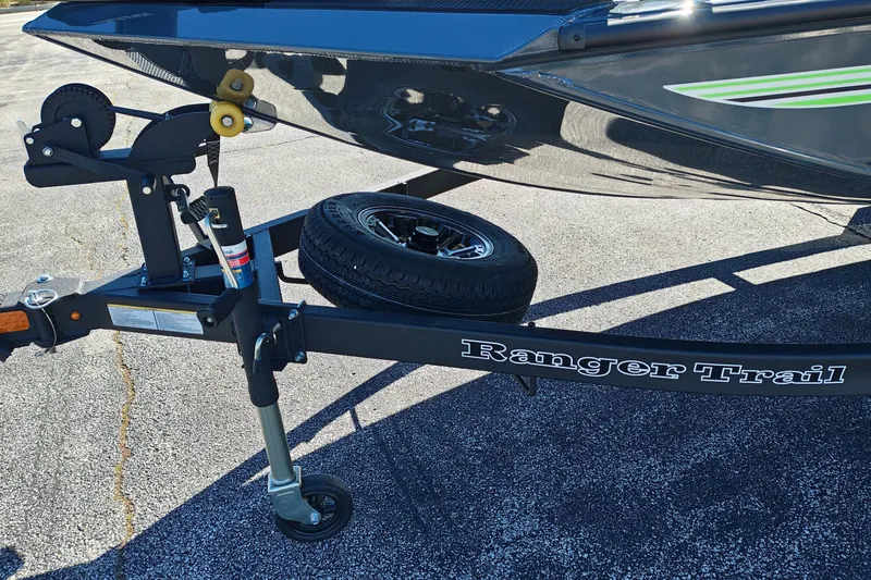 Slide: The Image of Trailer for 2027 Ranger RT198P boat with spare tire on asphalt. - 3
