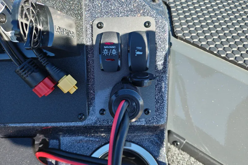 Slide: The Image of Control panel of 2027 Ranger RT198P boat with navigation and trim switches. - 34