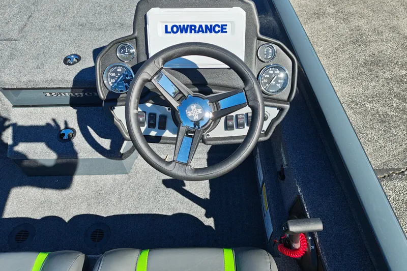 Slide: The Image of 2027 Ranger RT198P boat dashboard with Lowrance electronics and steering wheel. - 15