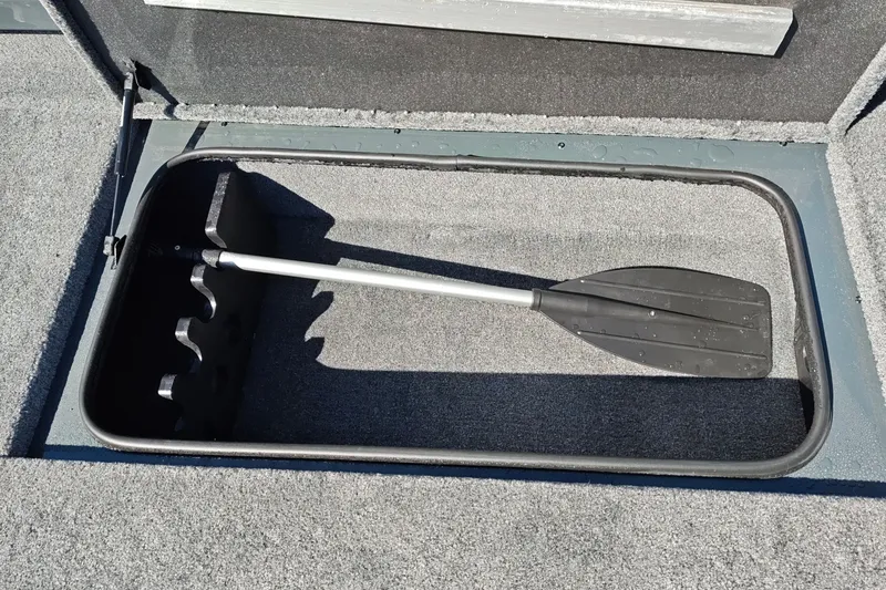 Slide: The Image of Storage compartment with paddle in 2027 Ranger RT198P boat. - 31