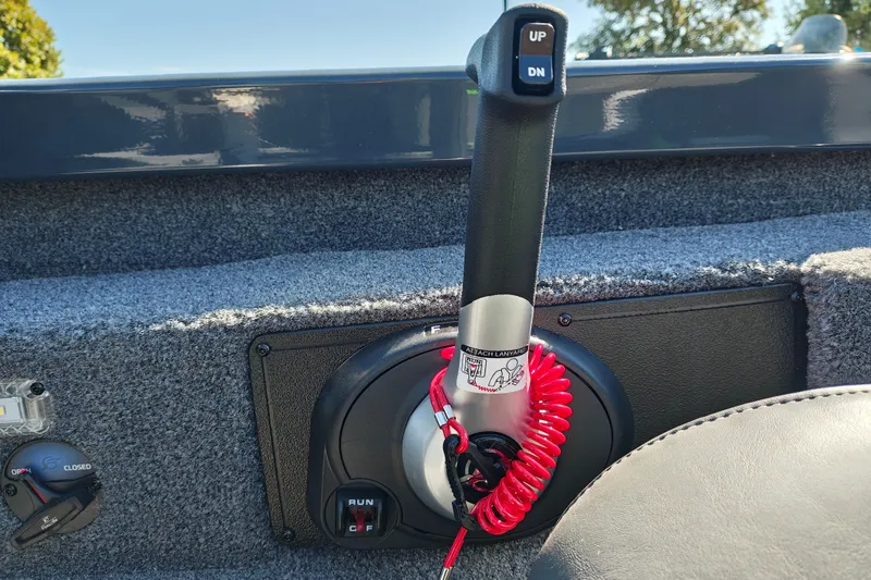 Slide: The Image of Throttle control of 2027 Ranger RT198P boat with safety lanyard and control switches. - 23