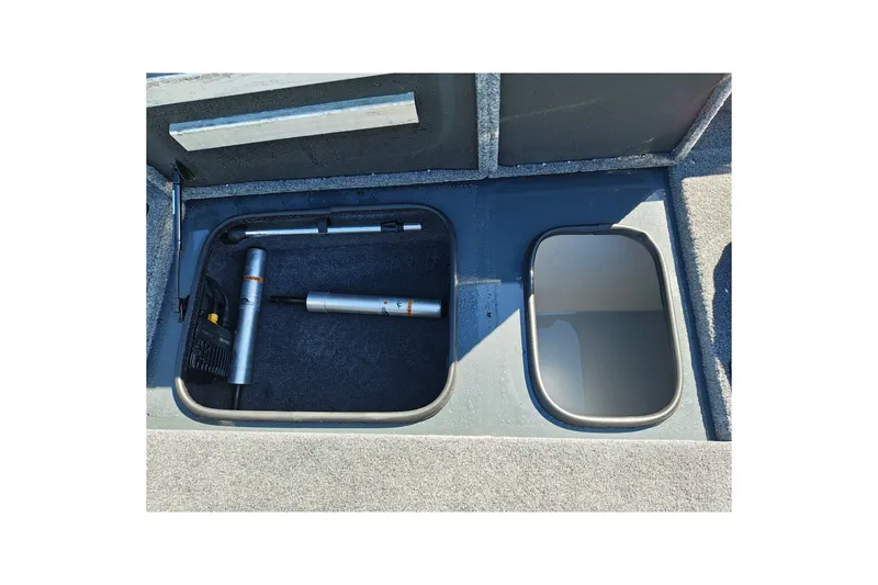 Slide: The Image of Storage compartments in a 2027 Ranger RT198P boat, featuring organized equipment. - 29