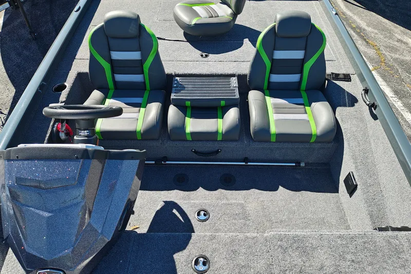 Slide: The Image of 2027 Ranger RT198P boat interior with gray and green seats, steering wheel, and console. - 38