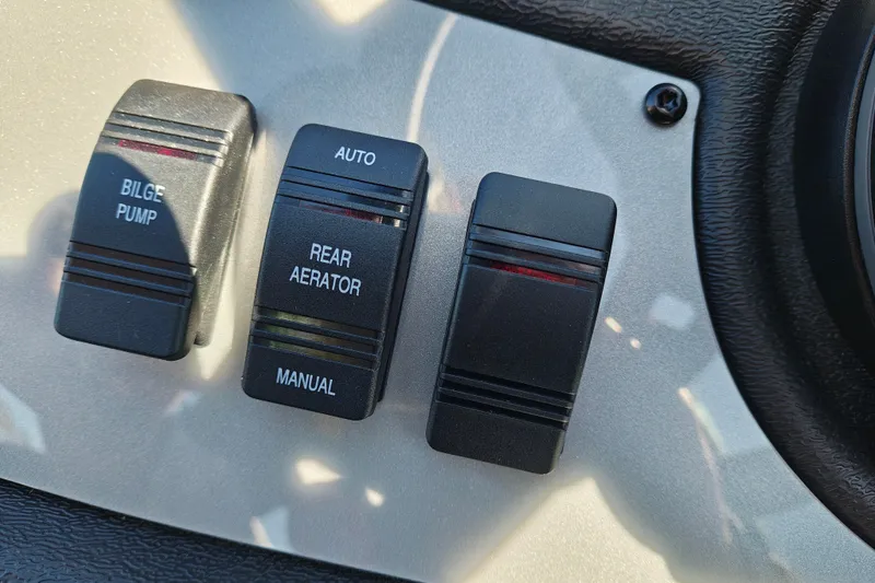 Slide: The Image of Control panel of 2027 Ranger RT198P boat with bilge pump and aerator switches. - 18