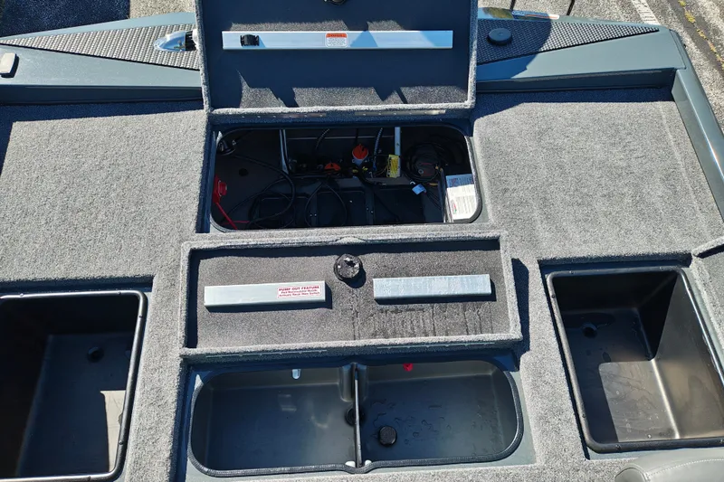 Slide: The Image of 2027 Ranger RT198P boat storage compartments with open lids and visible wiring. - 40