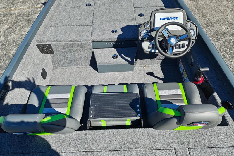 Slide: The Image of 2027 Ranger RT198P boat interior with steering wheel and seating, featuring Lowrance electronics. - 14