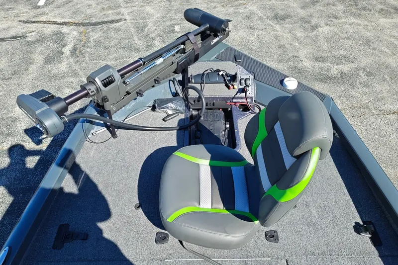 Slide: The Image of 2027 Ranger RT198P boat interior with trolling motor and green-accented seat. - 32