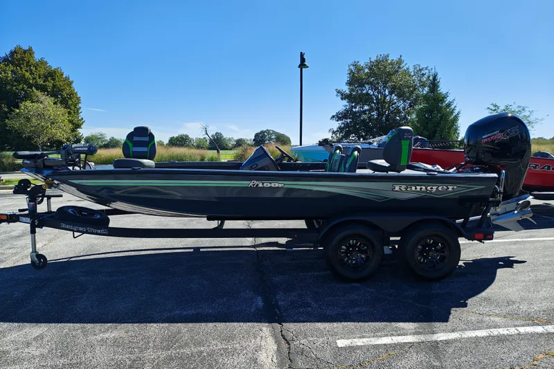 Slide: The Image of 2027 Ranger RT198P boat on trailer in sunny outdoor setting. - 1