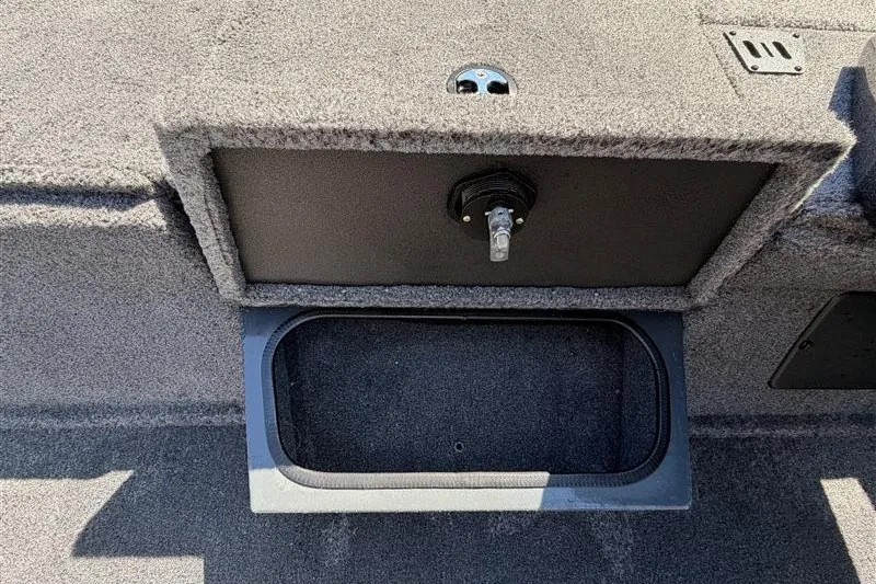 Slide: The Image of 2027 Ranger RT188P boat storage compartment with open lid, showcasing interior space. - 18
