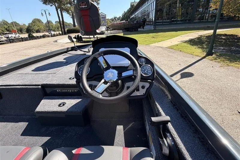 Slide: The Image of 2027 Ranger RT188P boat cockpit with steering wheel and dashboard controls. - 15