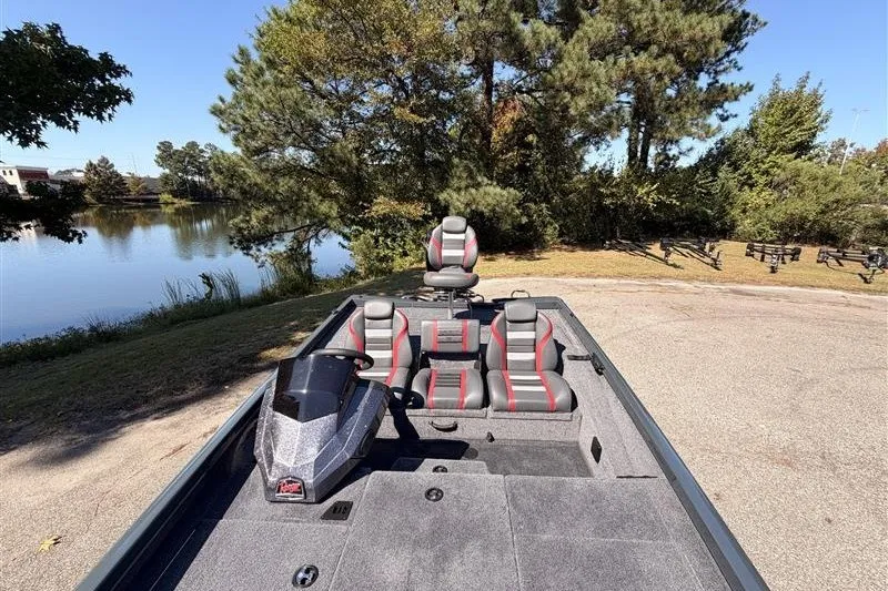 Slide: The Image of 2027 Ranger RT188P boat with seating, parked near a scenic lake. - 19