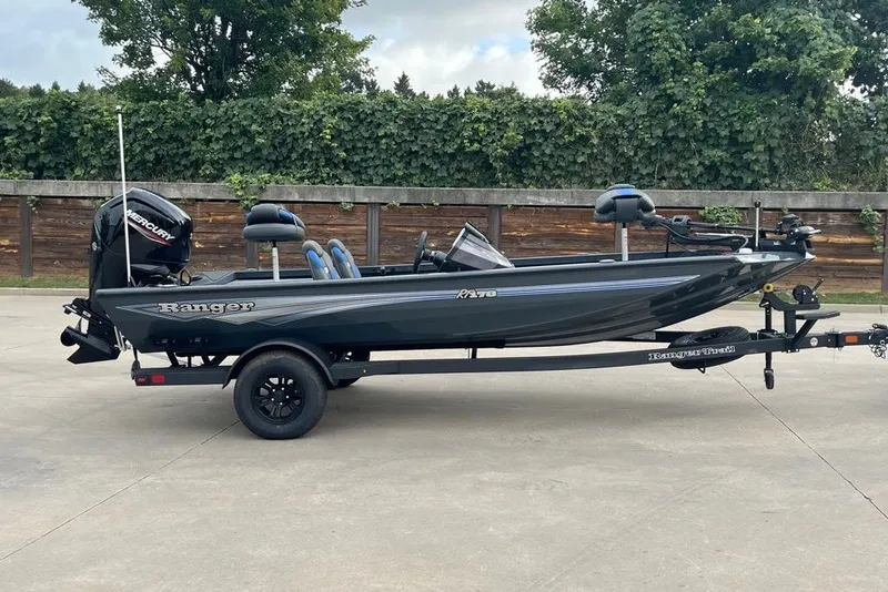 The Image of 2027 Ranger RT178 fishing boat on trailer, parked outdoors. - 0
