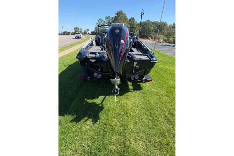 Slide: The Image of 2027 Nitro ZV20 Pro boat on grass, rear view with motor, sunny day. - 8