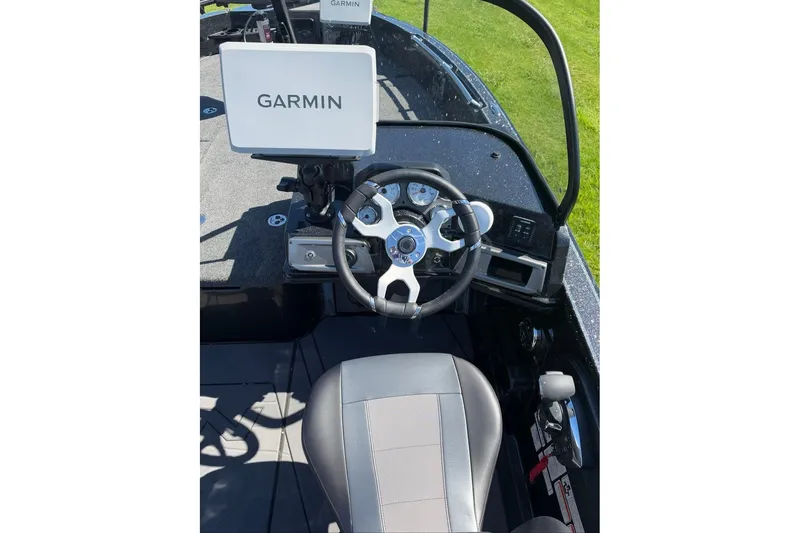 Slide: The Image of Cockpit of 2027 Nitro ZV20 Pro boat with Garmin navigation system and steering wheel. - 5