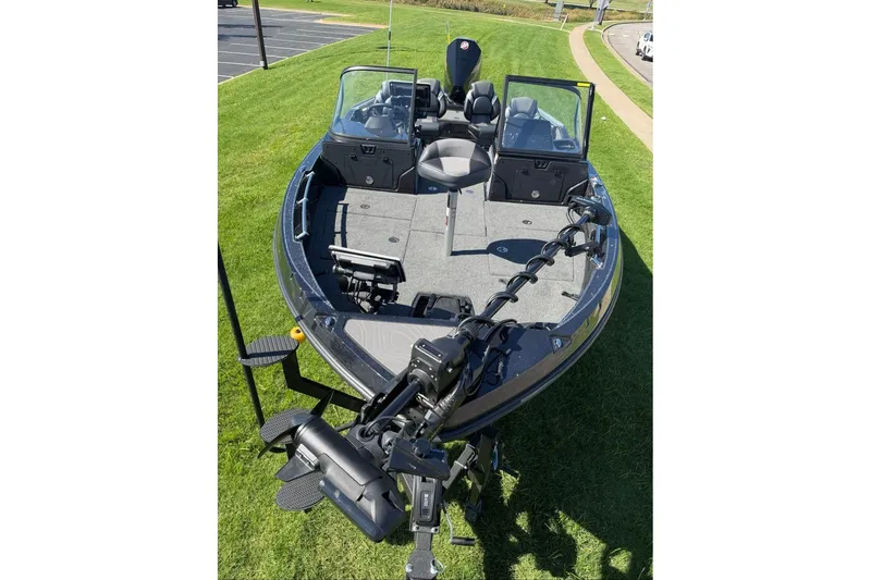 Slide: The Image of 2027 Nitro ZV20 Pro fishing boat on grass, showcasing deck and seating. - 10