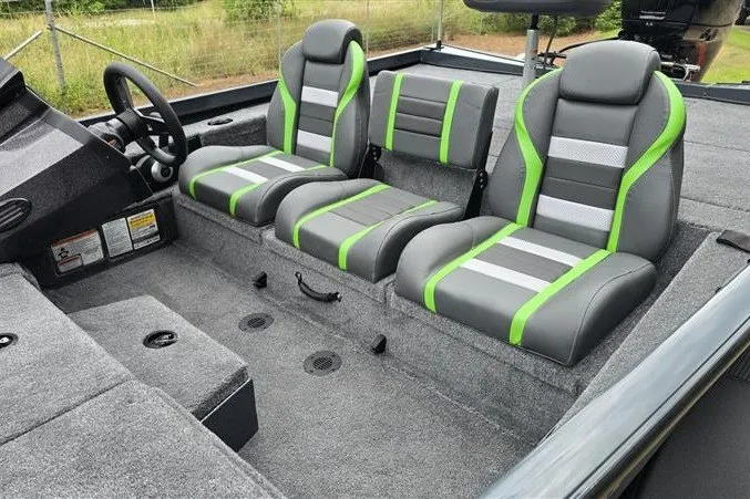 Slide: The Image of 2027 Ranger RT198P boat interior with gray and green seats, modern design. - 9