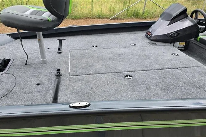 Slide: The Image of 2027 Ranger RT198P boat interior with gray carpet and seating. - 14