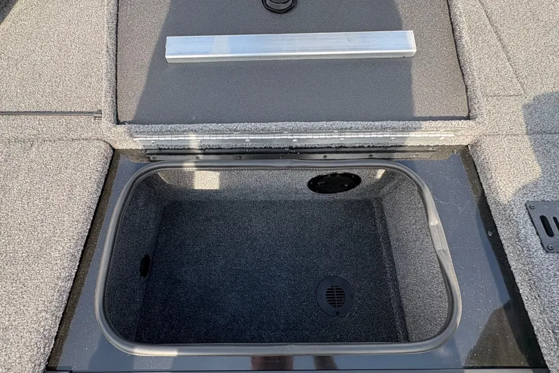Slide: The Image of 2027 Ranger RT178C boat storage compartment with open lid, showcasing interior space. - 15