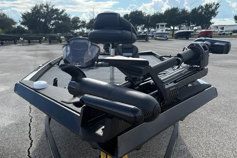 Slide: The Image of 2027 Ranger RT178C boat with advanced trolling motor in a parking lot. - 2