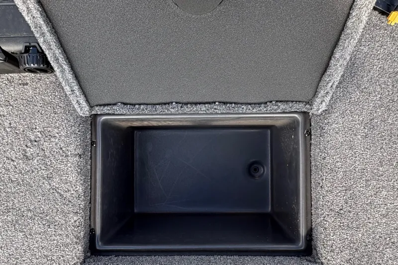 Slide: The Image of Open storage compartment on 2027 Ranger RT178C boat deck with carpeted surface. - 17