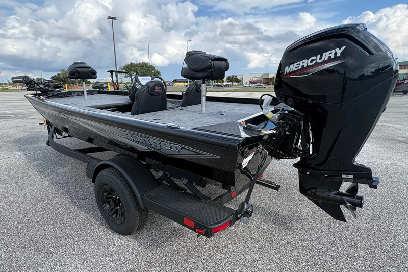 Slide: The Image of 2027 Ranger RT178C boat with Mercury engine in parking lot, under cloudy sky. - 4
