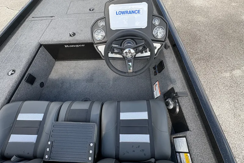 Slide: The Image of 2027 Ranger RT178C boat interior with steering wheel and Lowrance display. - 18