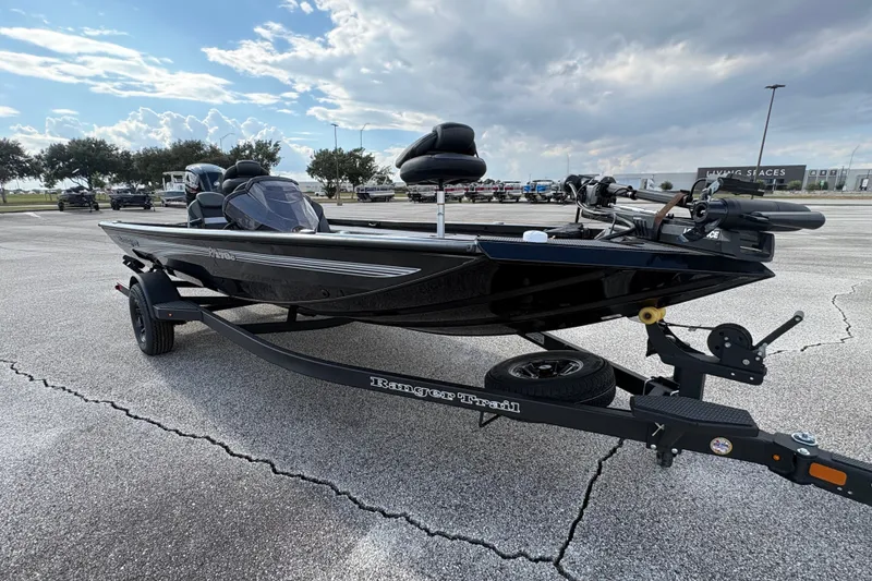 Slide: The Image of 2027 Ranger RT178C boat on trailer in parking lot under cloudy sky. - 7