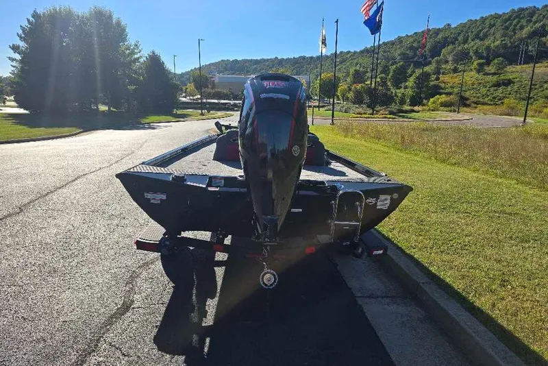 Slide: The Image of 2027 Ranger RT188C boat on trailer, parked in sunny outdoor setting. - 4