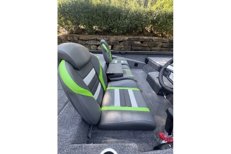 Slide: The Image of 2027 Ranger RT198P boat interior with gray and green seats, steering wheel visible. - 5