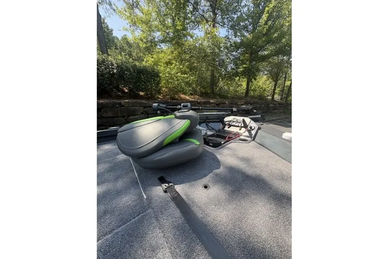 Slide: The Image of 2027 Ranger RT198P boat deck with seat and fishing equipment under trees. - 6