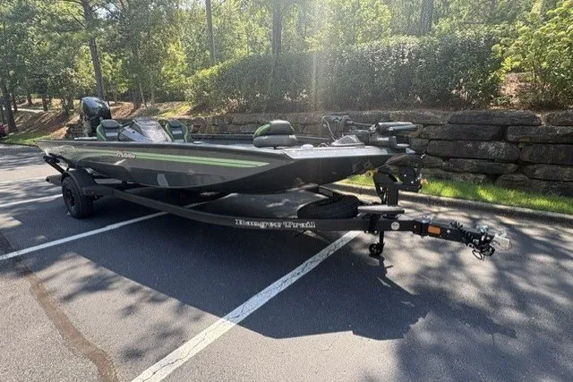 Slide: The Image of 2027 Ranger RT198P boat on trailer in sunny parking lot. - 9